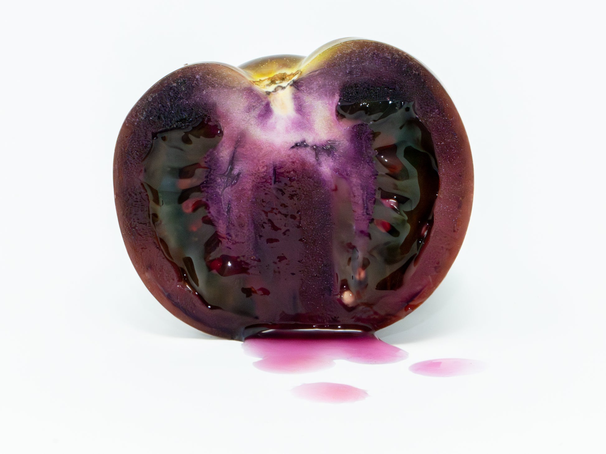 NHP Dark Hollow Fruit sliced in half